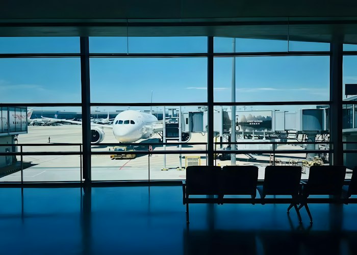 Aircraft at an airport gate representing aviation and transport ground power